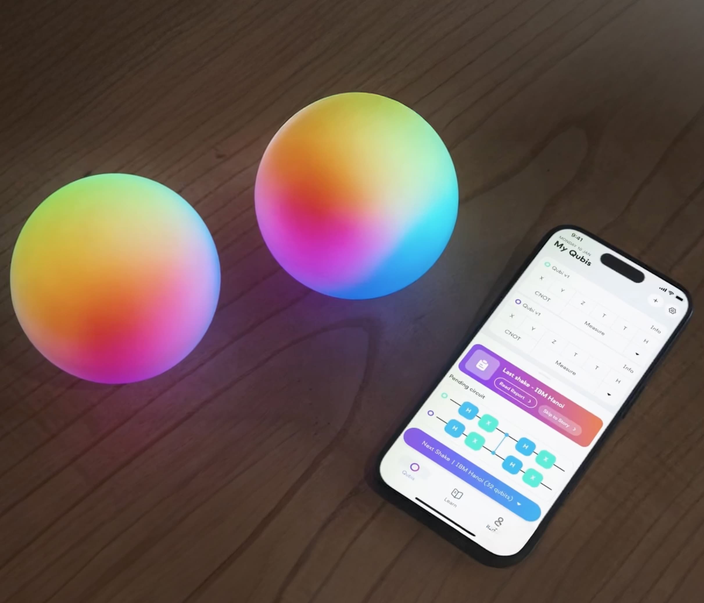 The Qubi app shown alongside a pair of Qubi spheres